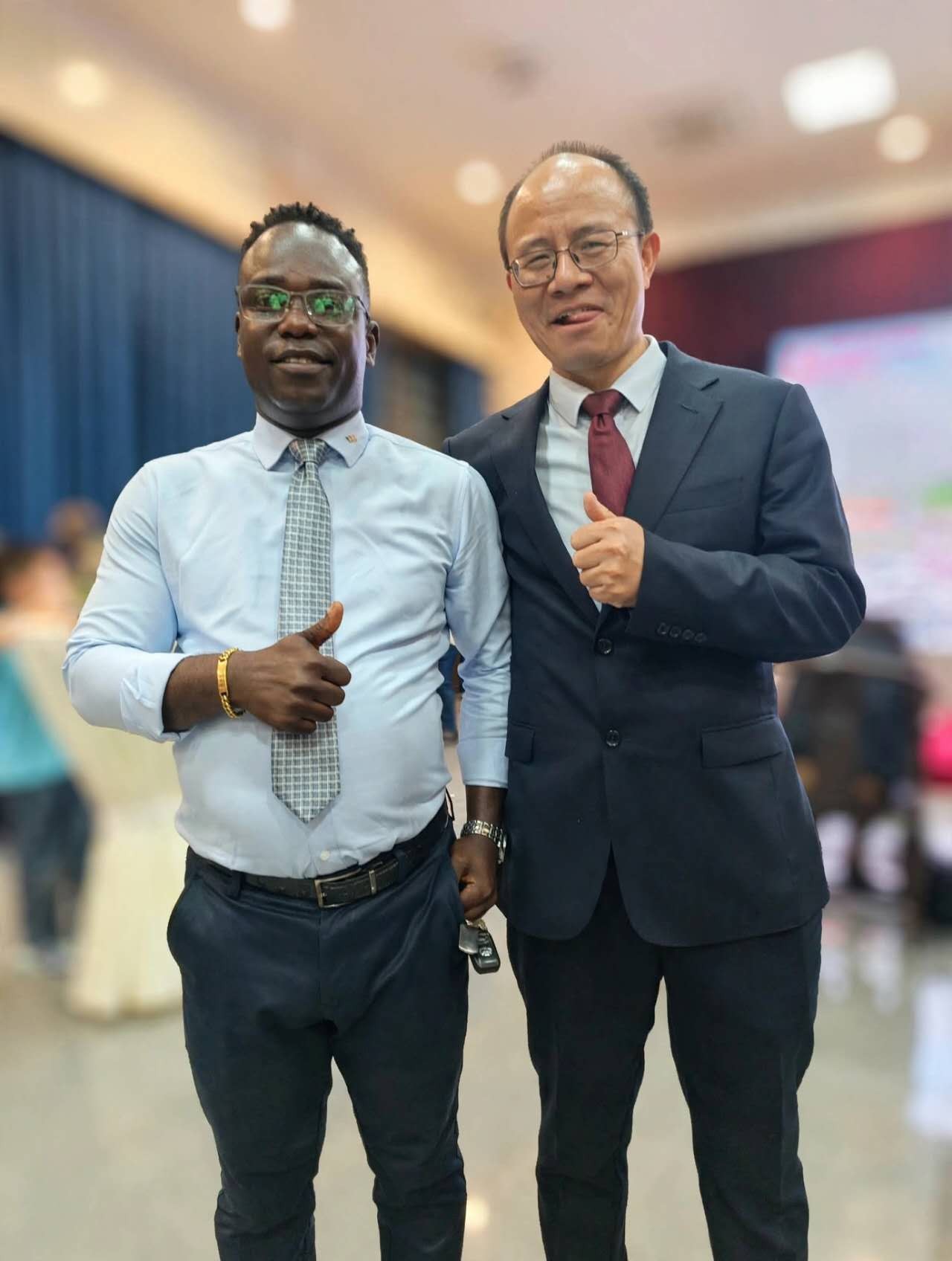 Dr. Emmanuel Fred with a representative of the Embassy of the People’s Republic of China in Liberia.